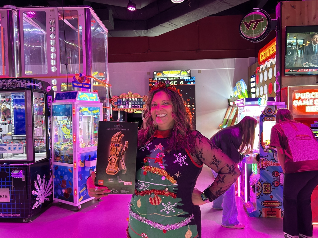 A guest holding an arcade prize